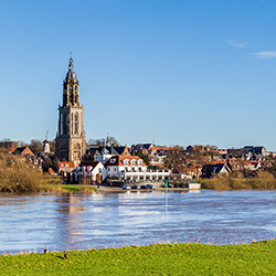 Landscape with a view on the flooded river Rhine and the small town  Rhenen in the Netherlands